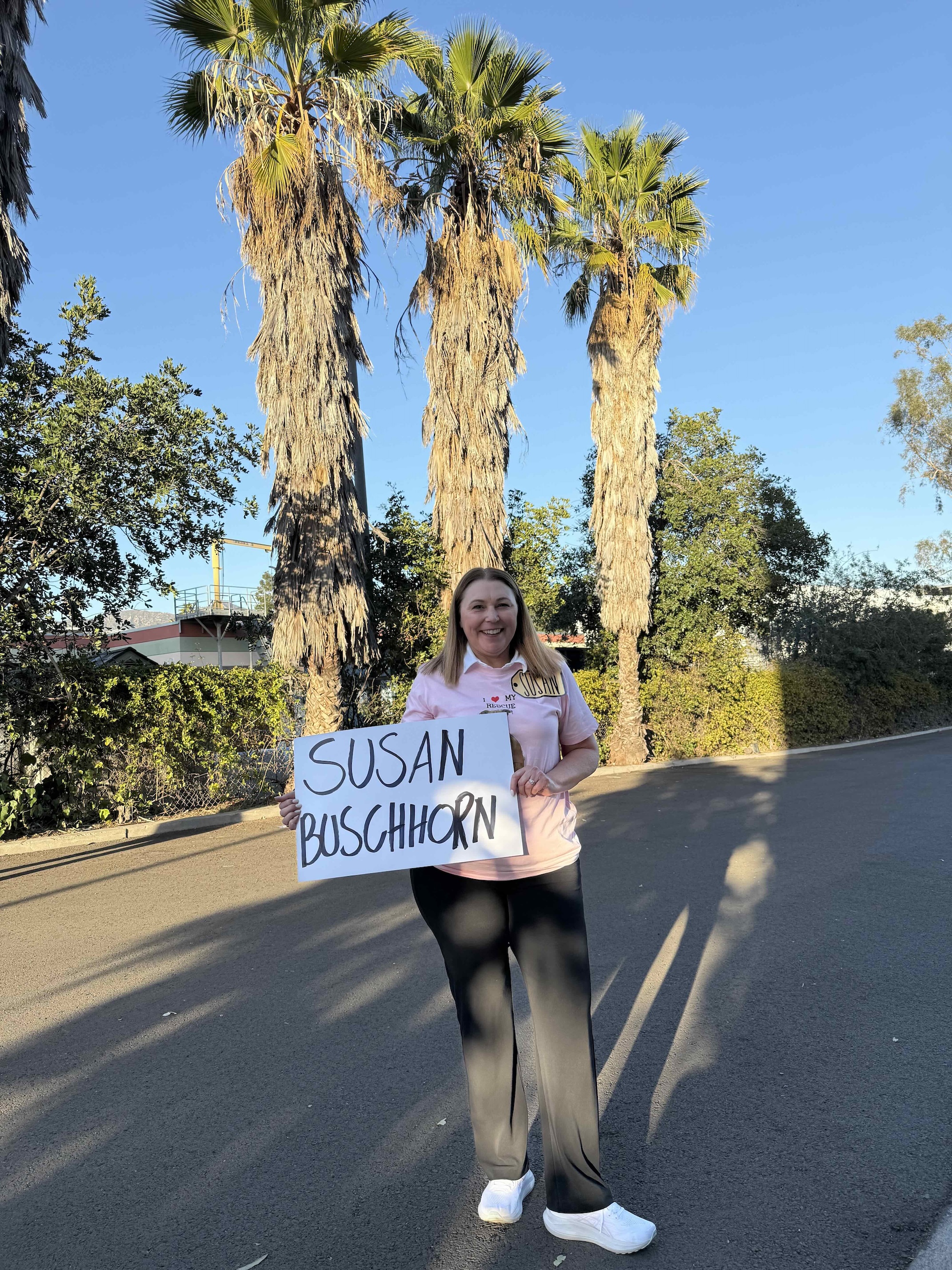 A person holding a sign
AI-generated content may be incorrect.