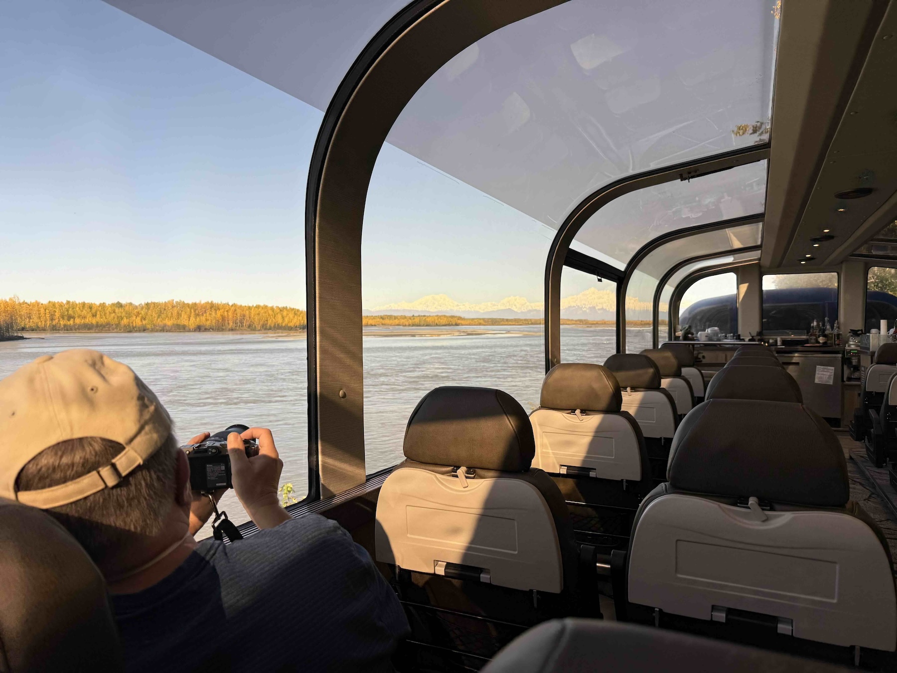 A person taking a picture of a boat
AI-generated content may be incorrect.