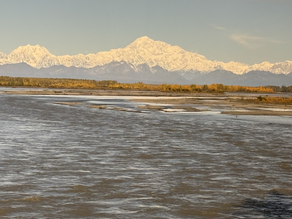 A lake with mountains in the background
AI-generated content may be incorrect.